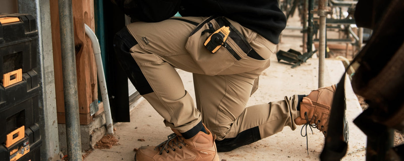 Close-up image of a man wearing a pair of Desert Hard Yakka  Men's Raptor Active Work Trousers